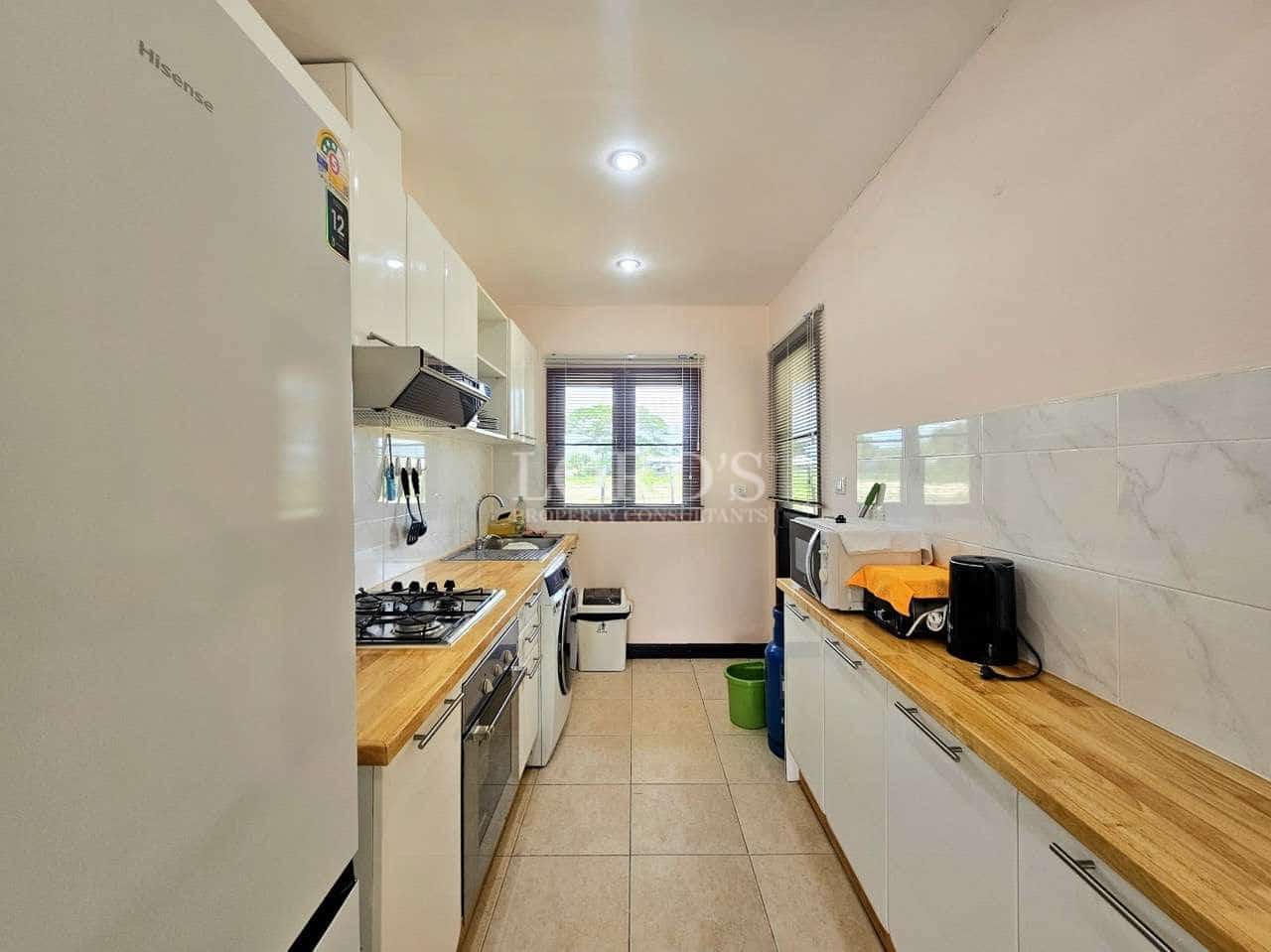 Modern kitchen with wooden countertops.