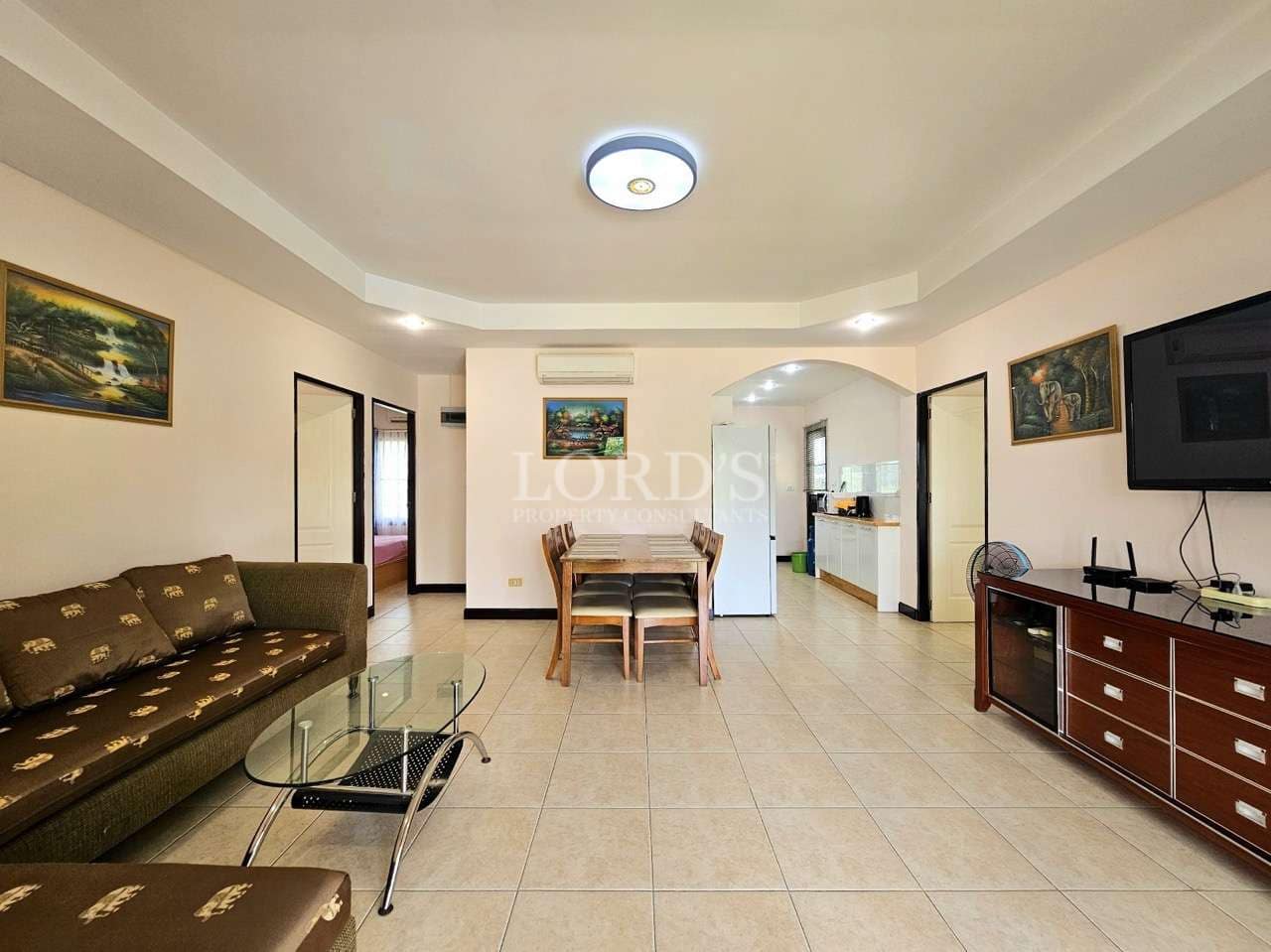 Spacious living area with dining table.