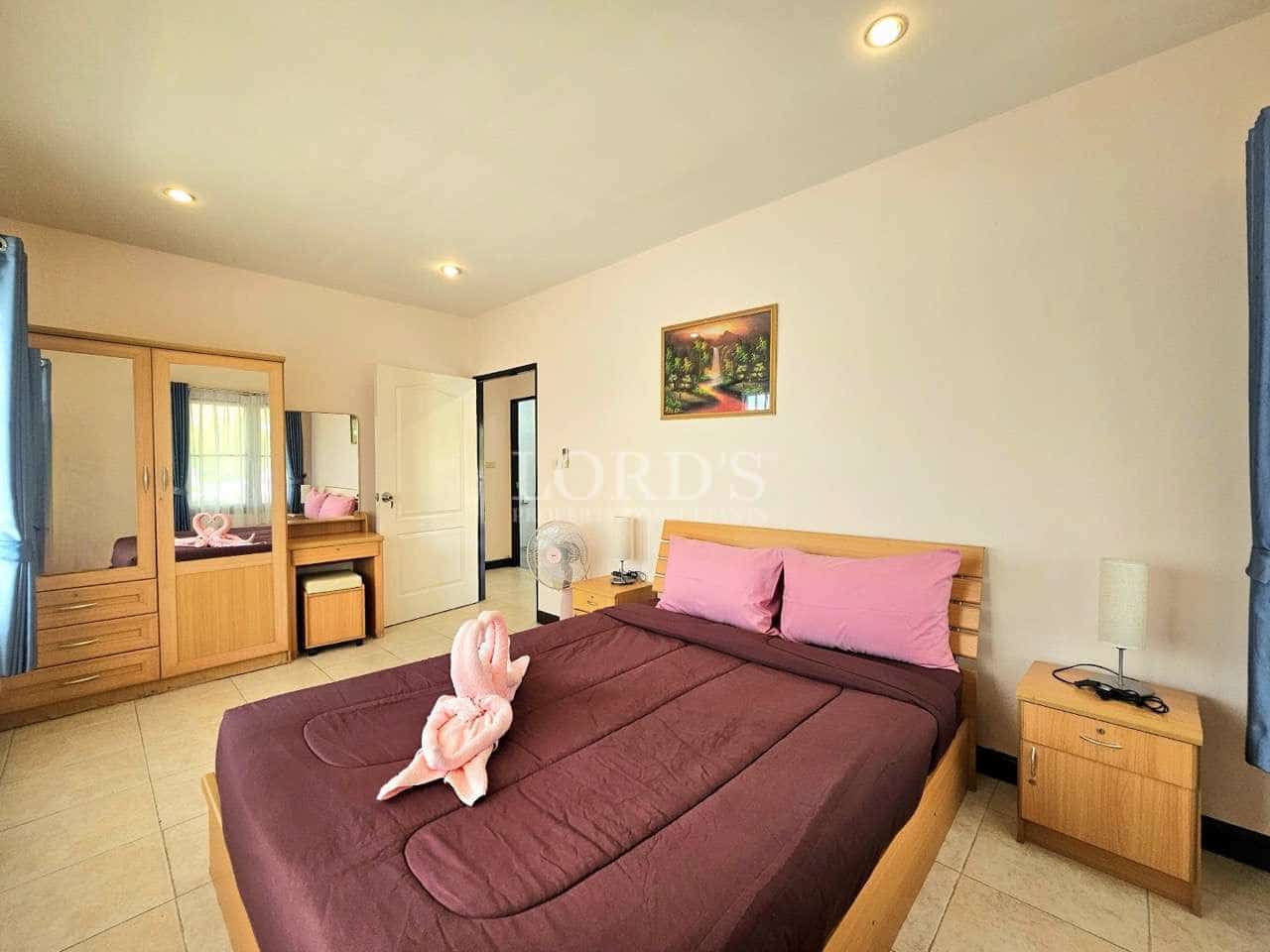 Cozy bedroom with pink accents.