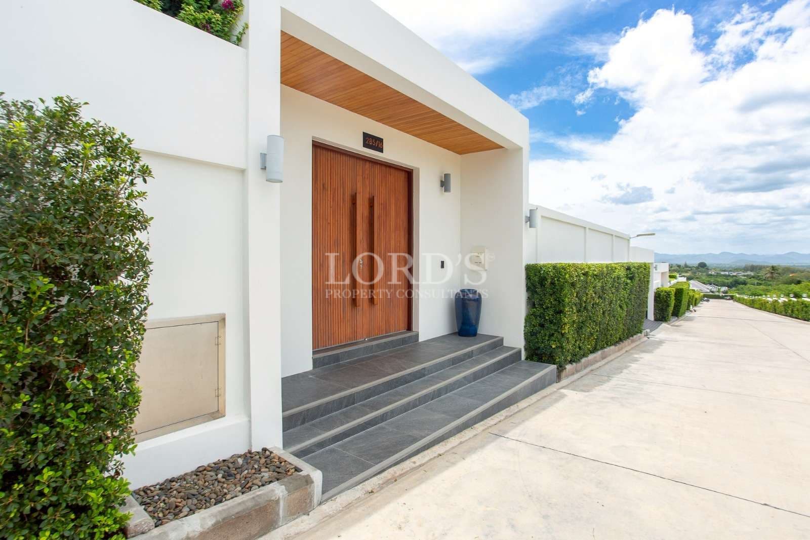 Modern entrance with landscaped surroundings