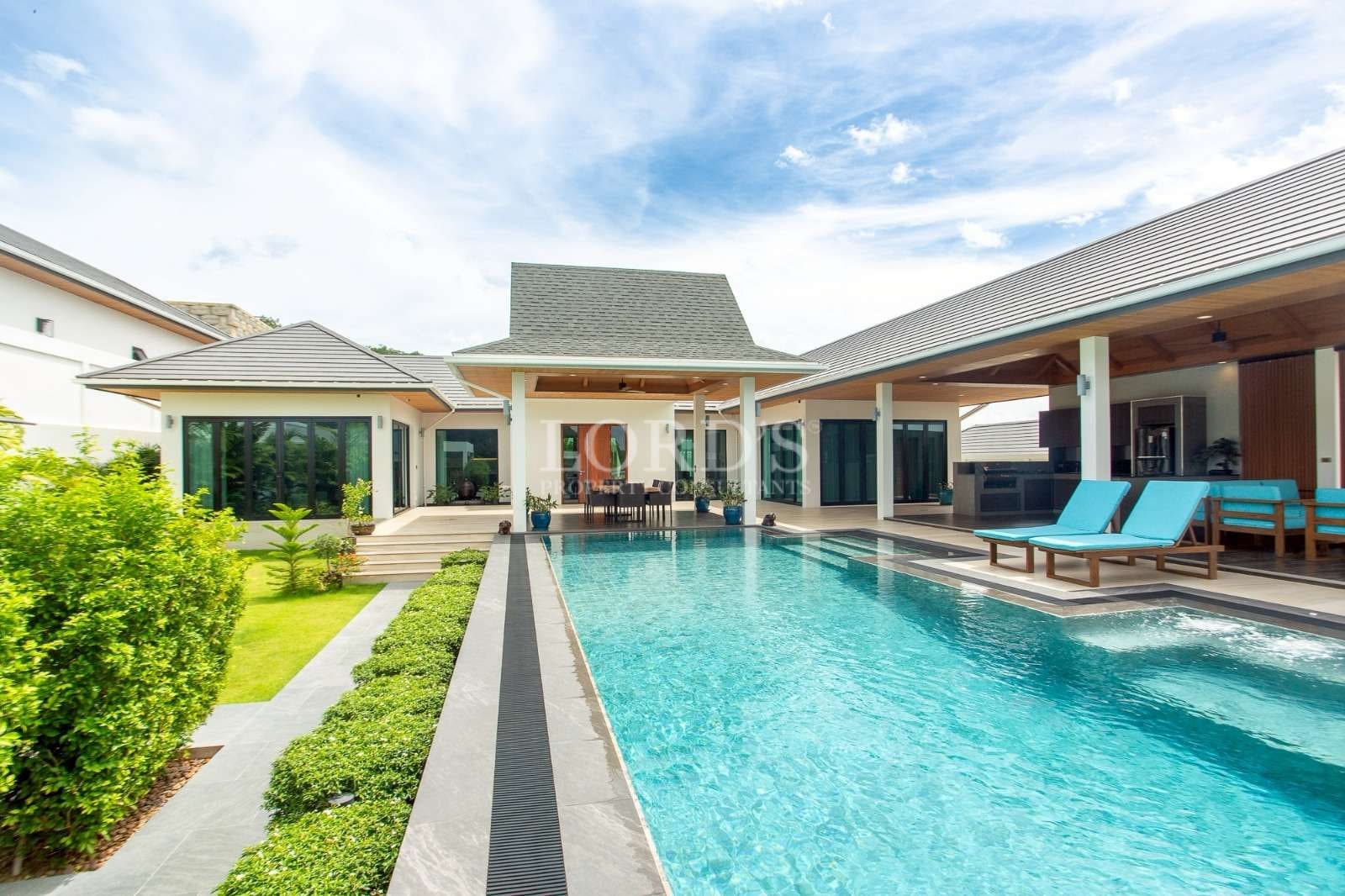 Modern villa with pool and greenery