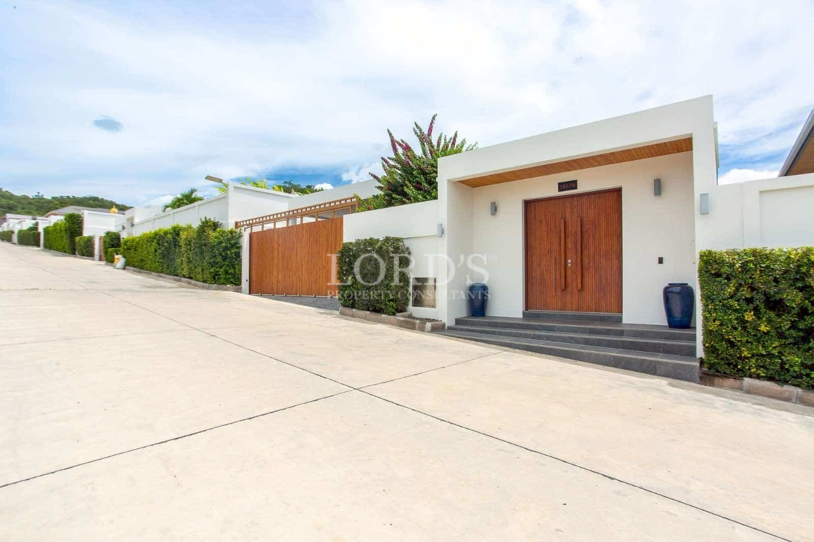 Modern house entrance with greenery