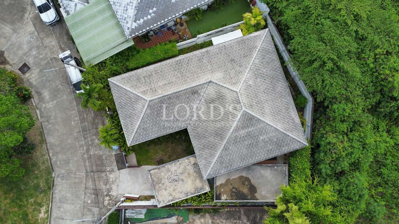 Aerial view of a house and garden.