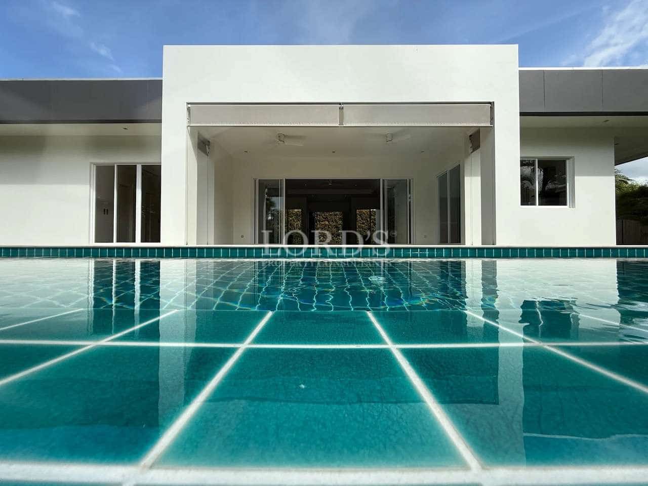 Modern house with swimming pool reflection
