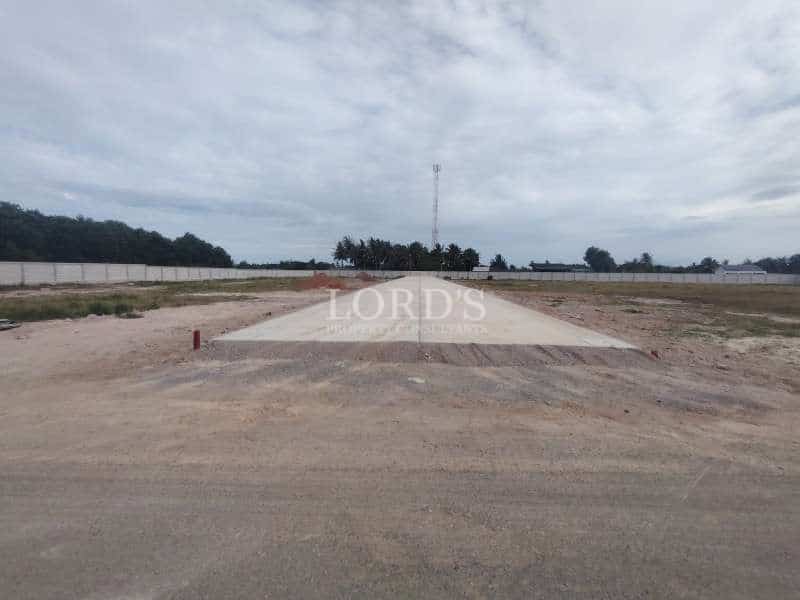 Empty land with cloudy sky
