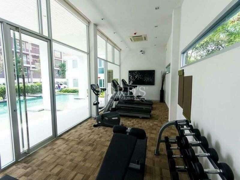 Modern gym with exercise equipment.