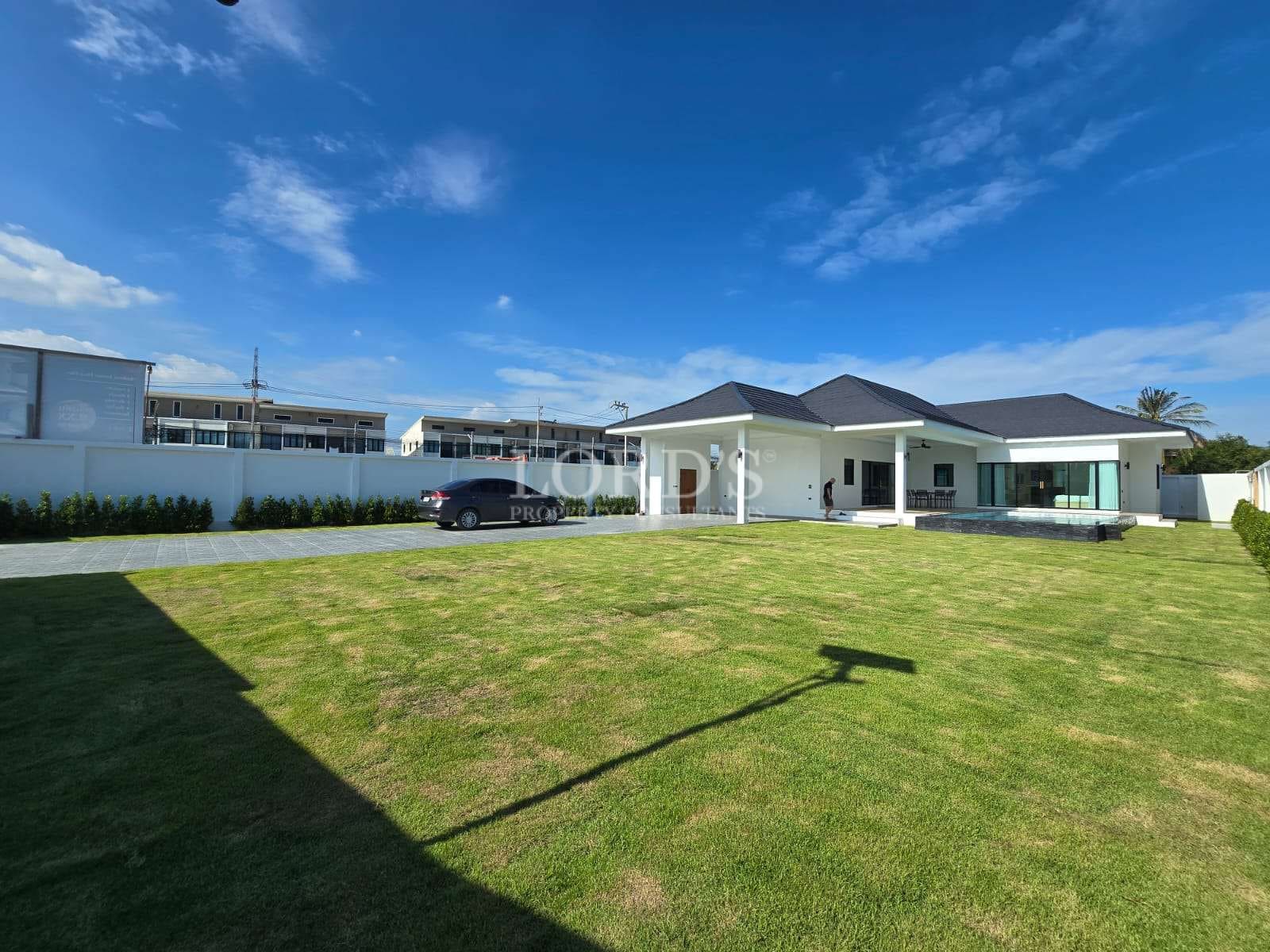 Modern house with green lawn