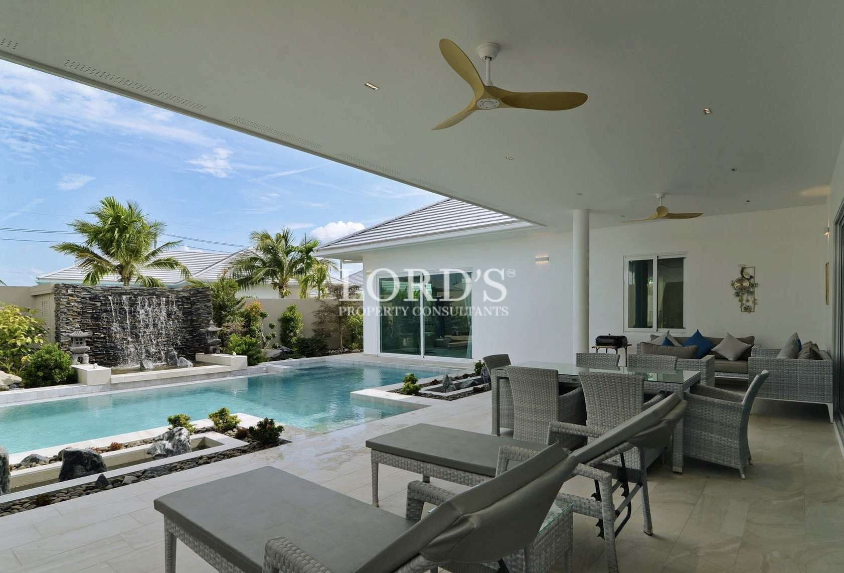 Modern patio with pool and waterfall