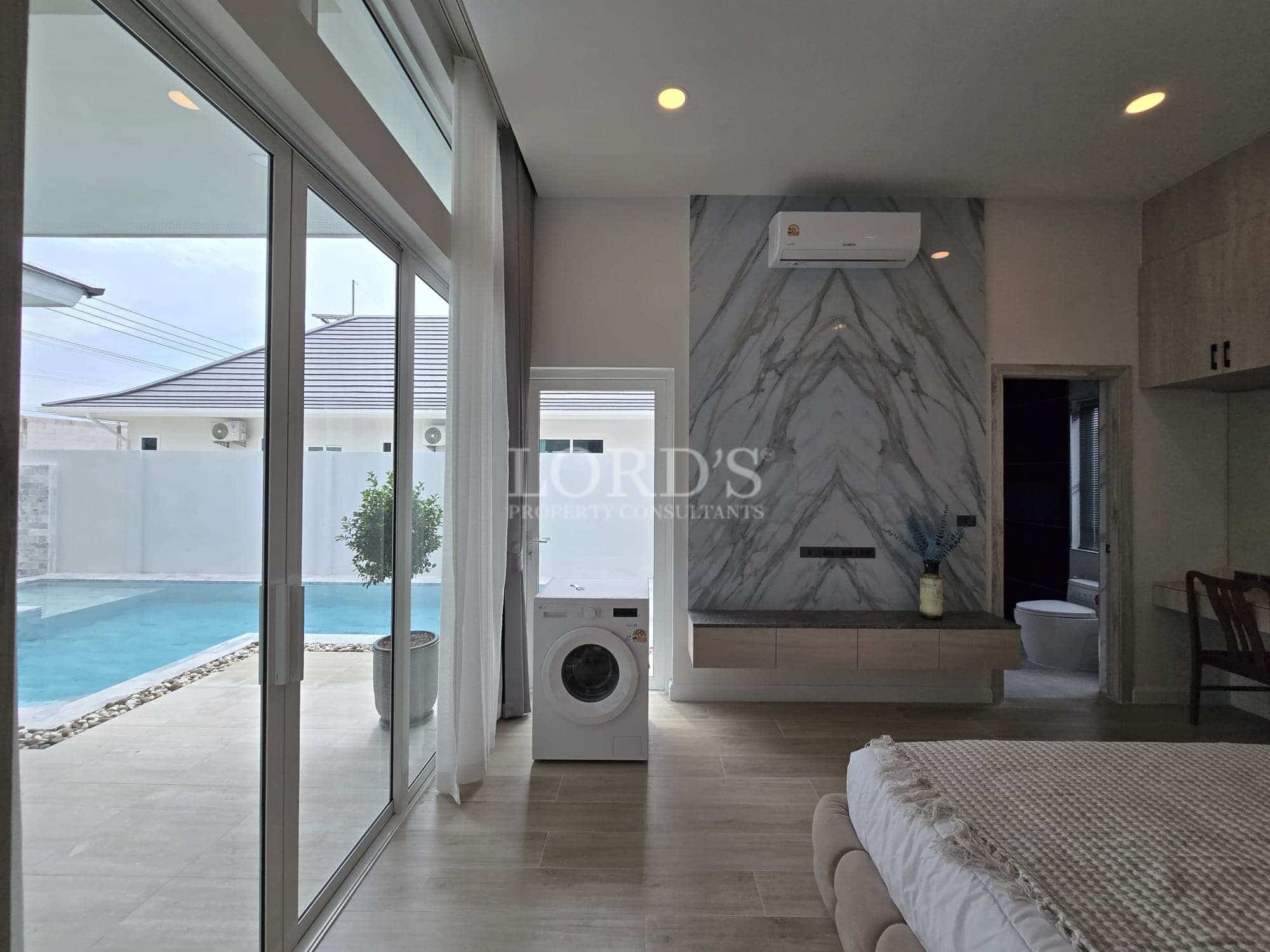 Modern bedroom with pool view