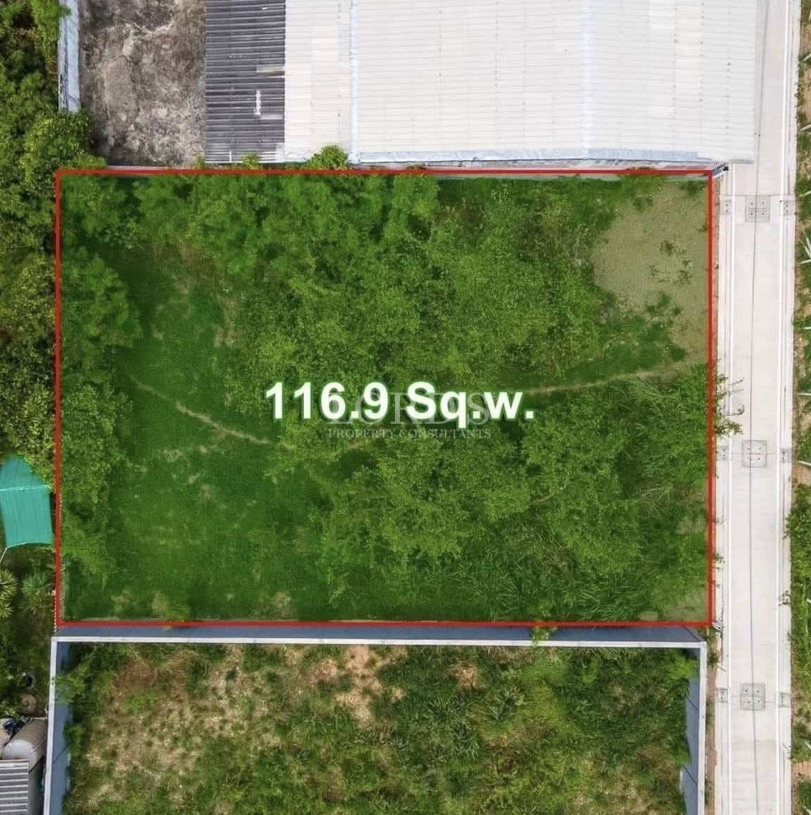 Top-down aerial view of a 116.9 square wah land plot outlined in red with road access on one side.