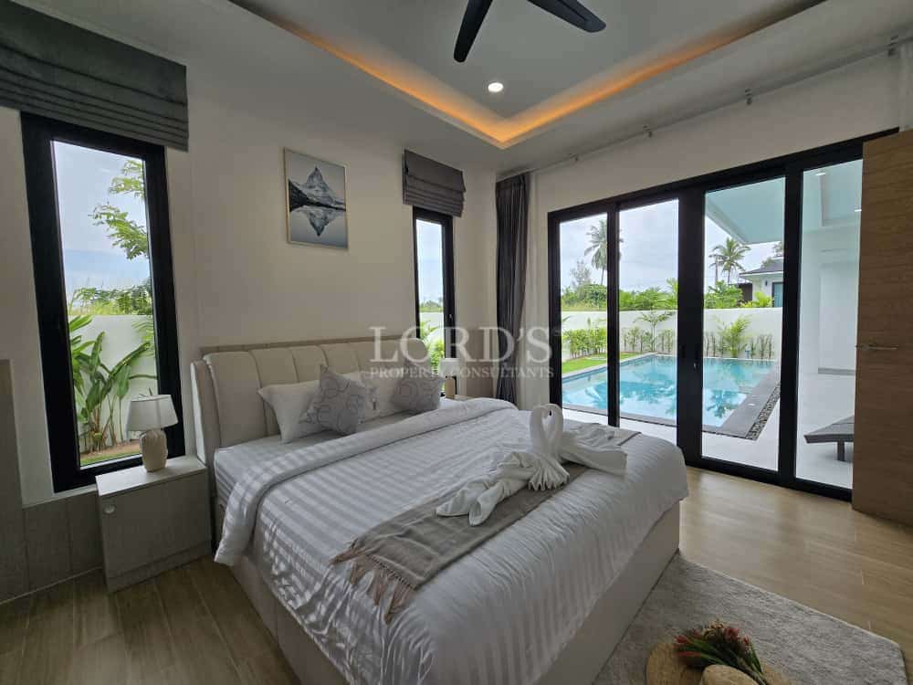Modern bedroom with pool view