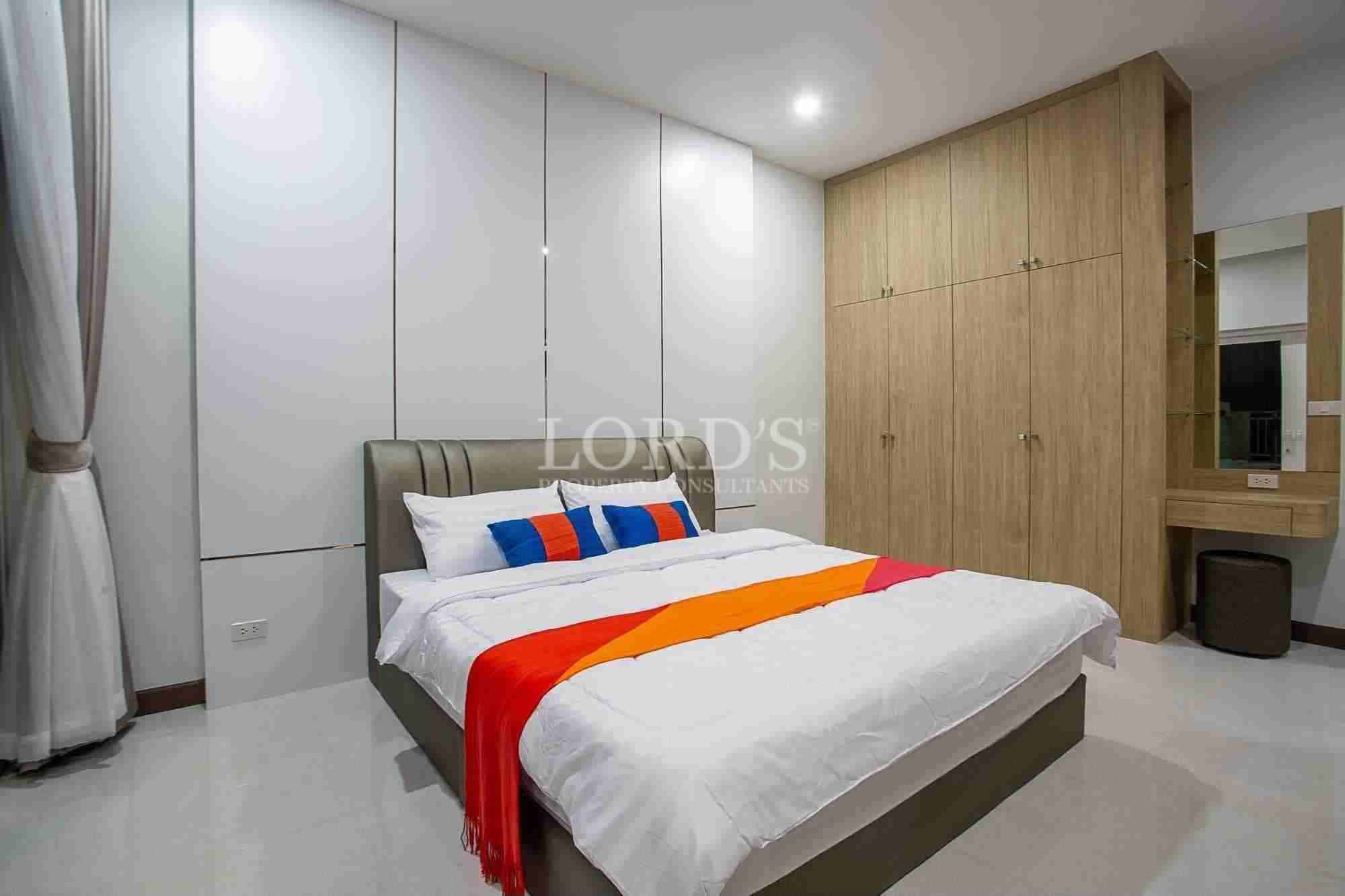 Modern bedroom with colorful decor.