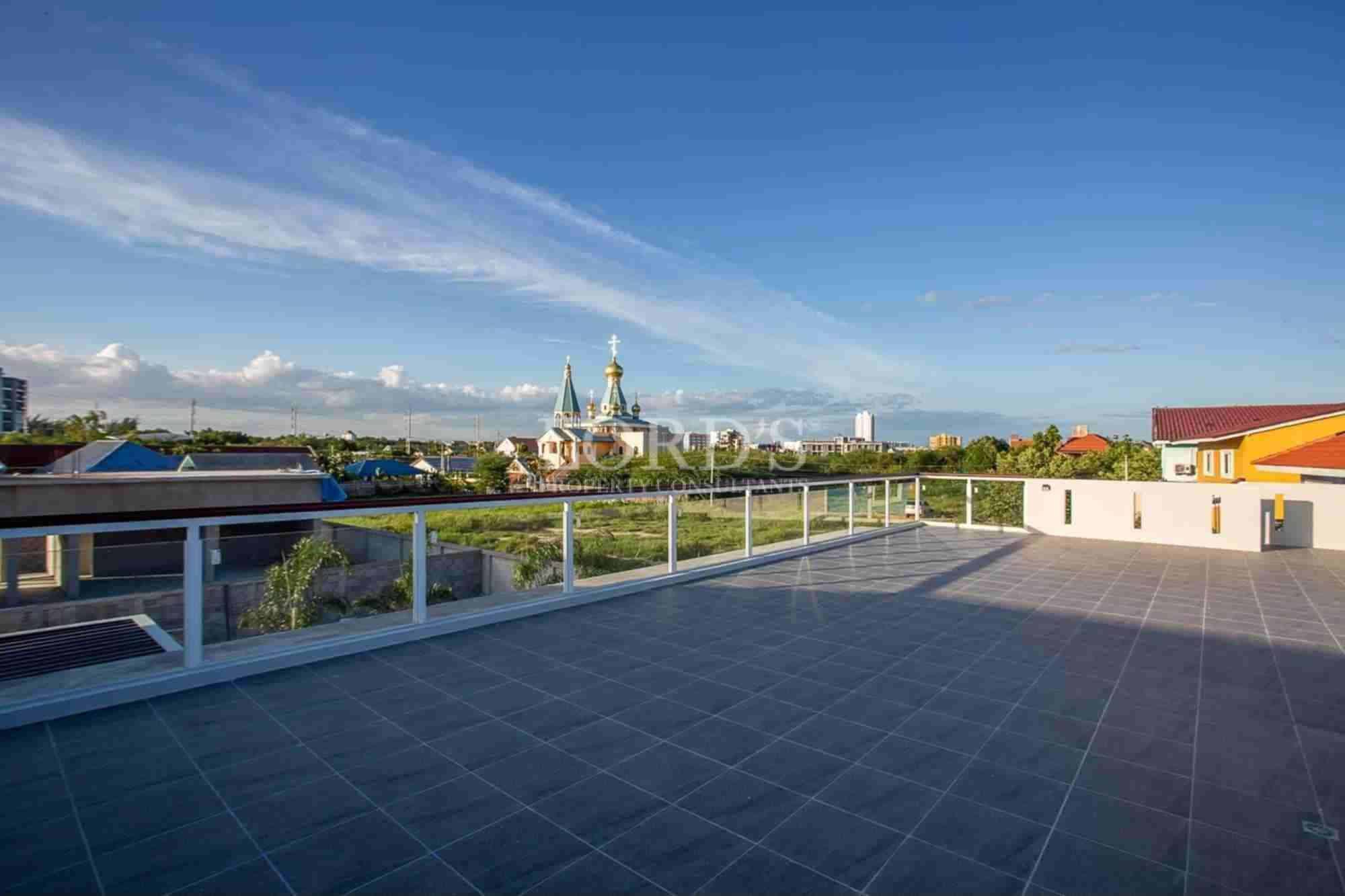 Modern poolside area at twilight.