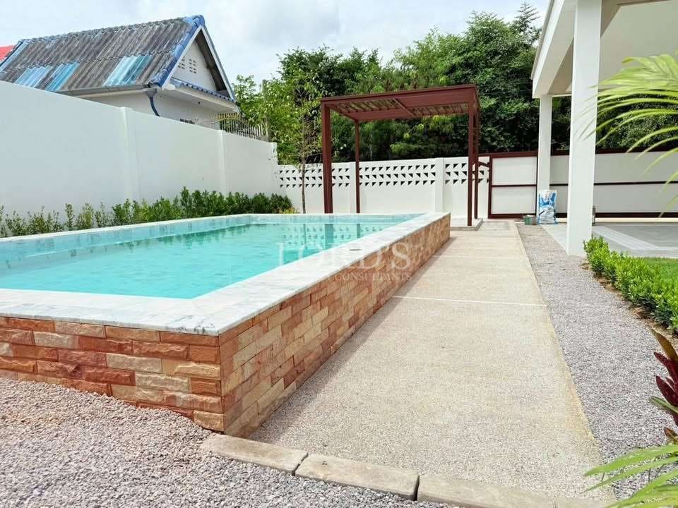 Modern poolside with landscaped surroundings