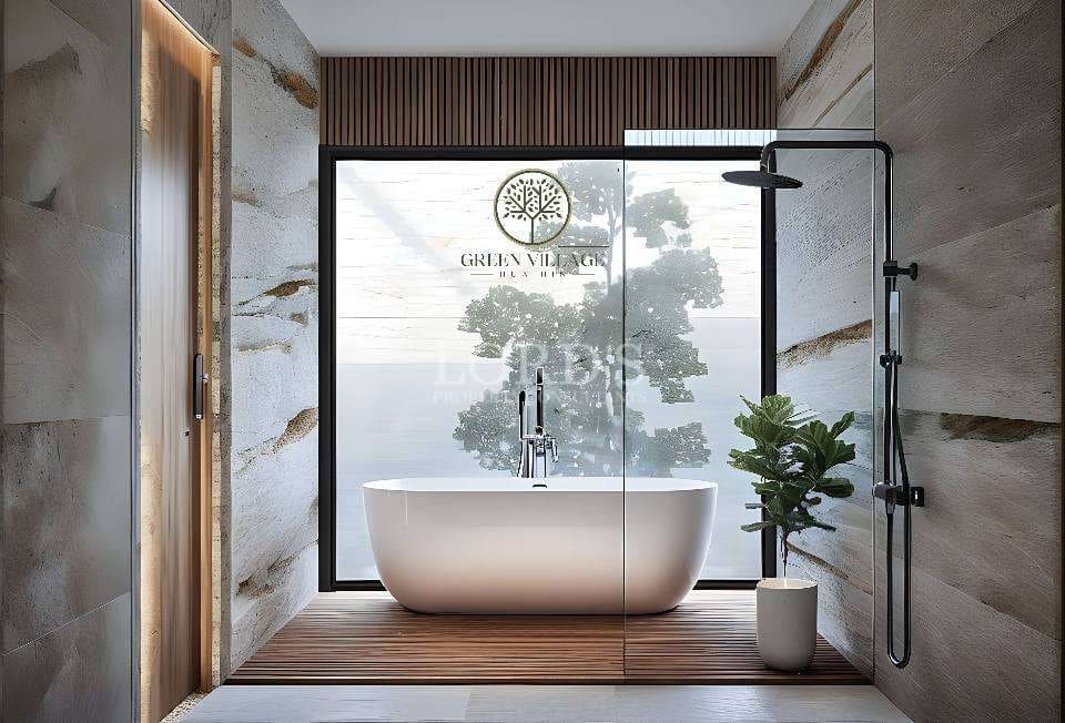 Modern bathroom with bathtub and greenery