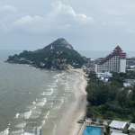 Coastal view with mountain backdrop.