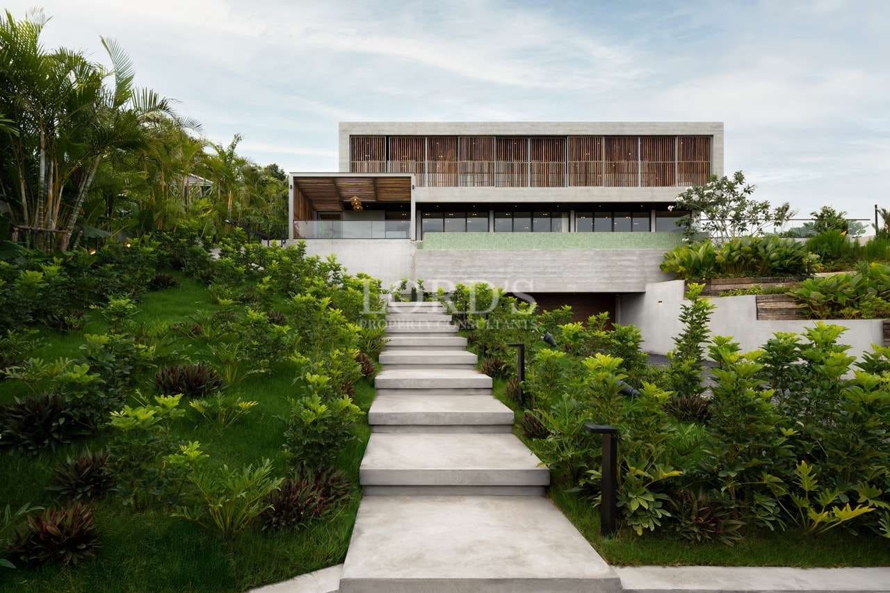 Modern house with lush landscaping.