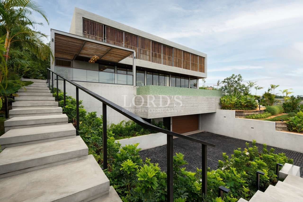 Modern house with lush landscaping.