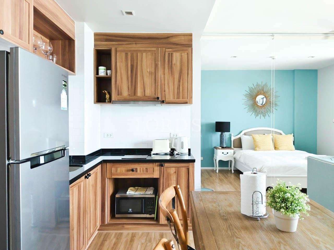 Modern kitchen and cozy bedroom.