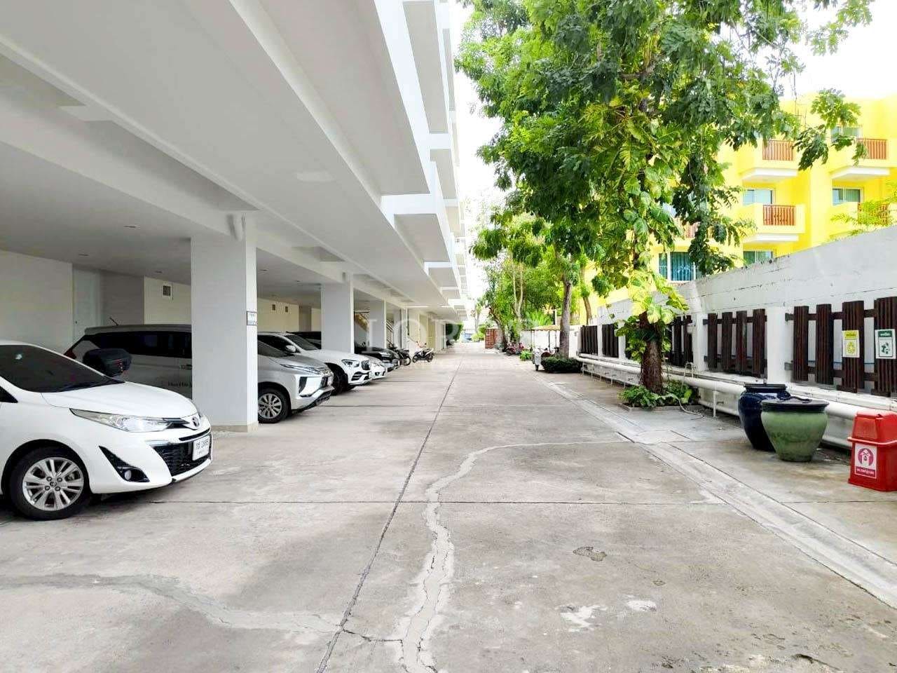 Empty parking lot with greenery