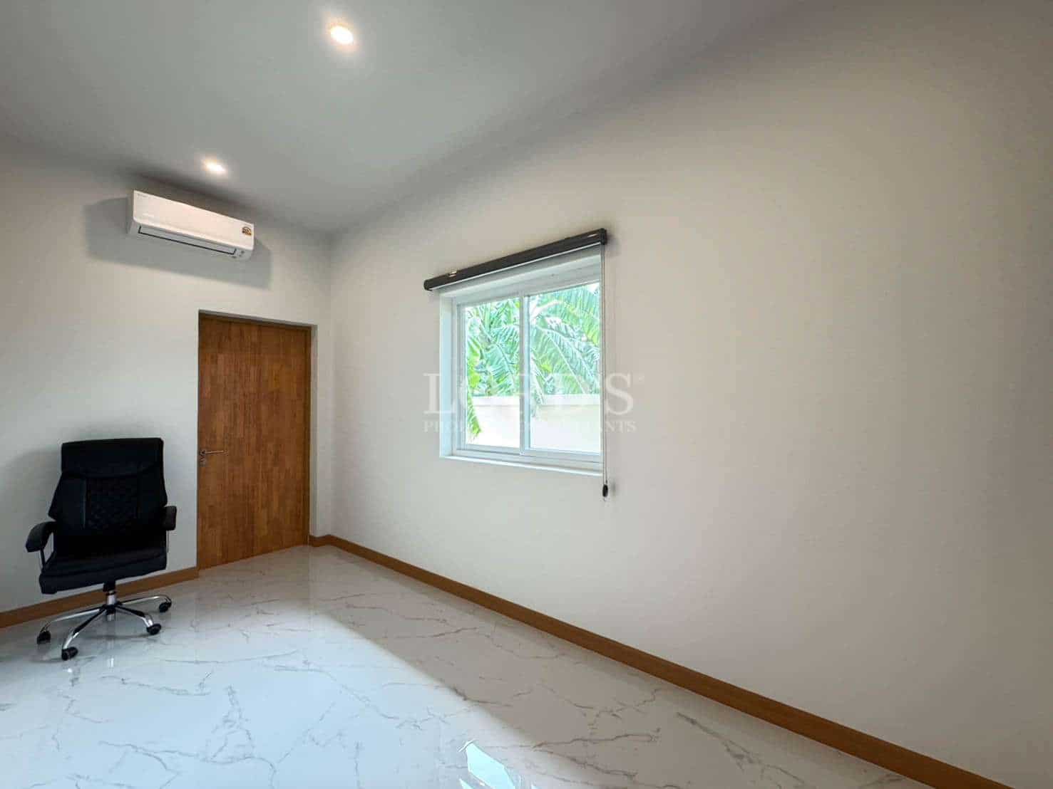 Empty room with chair and window