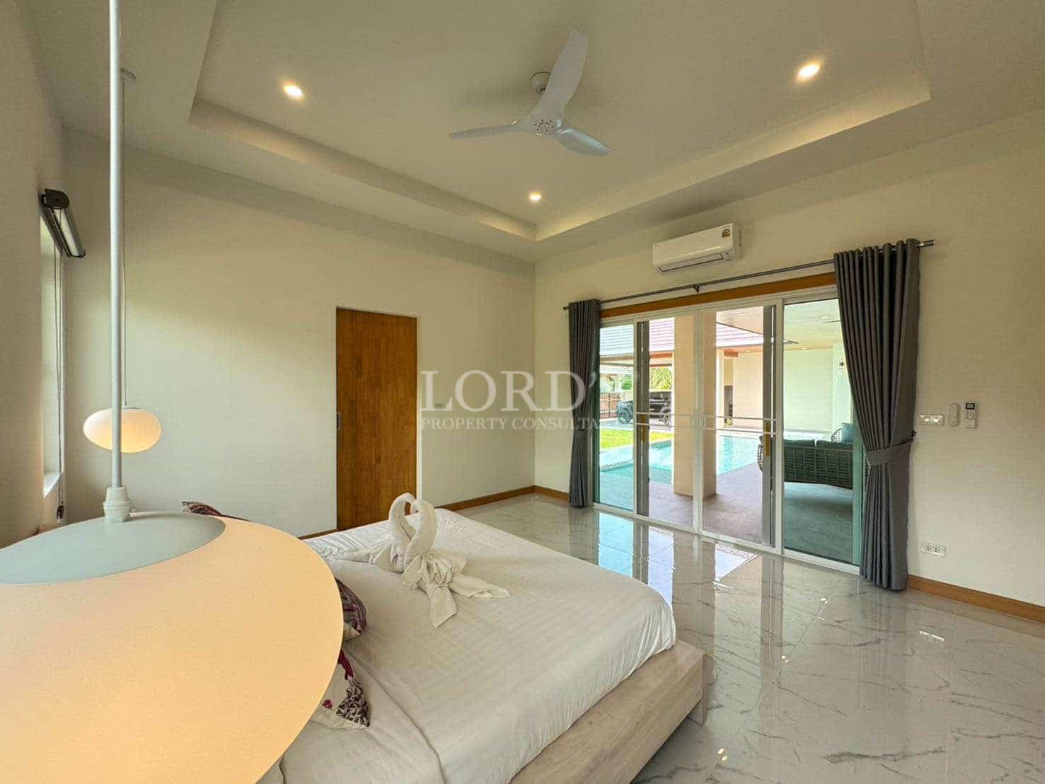 Modern bedroom with pool view