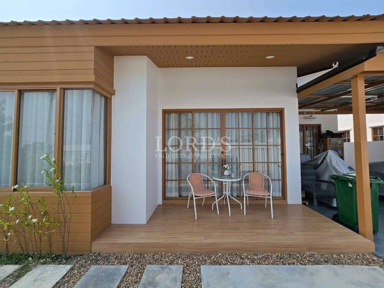 Modern house with patio seating area