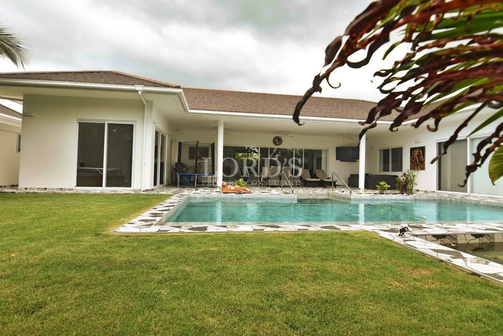 Modern house with pool and lawn