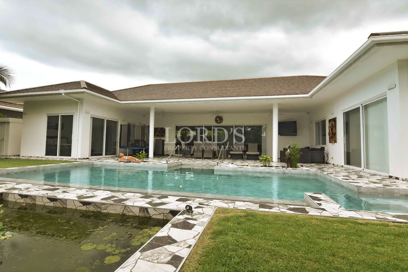 Modern villa with pool and greenery