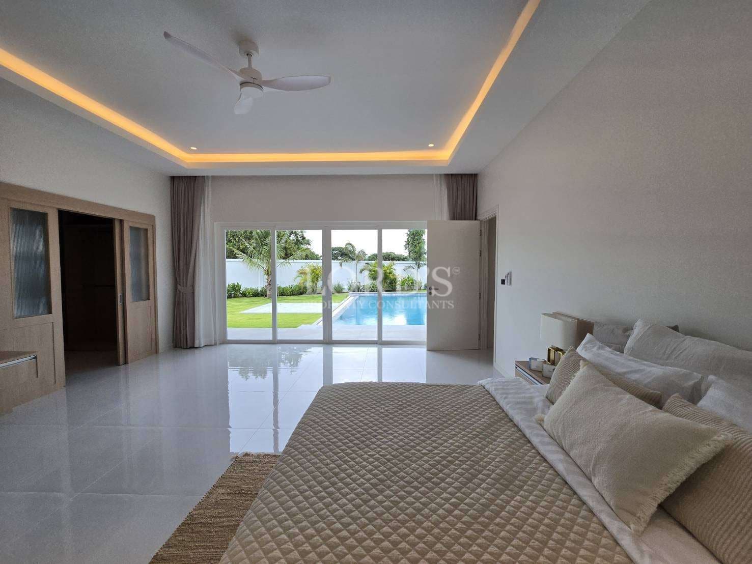 Modern bedroom with pool view