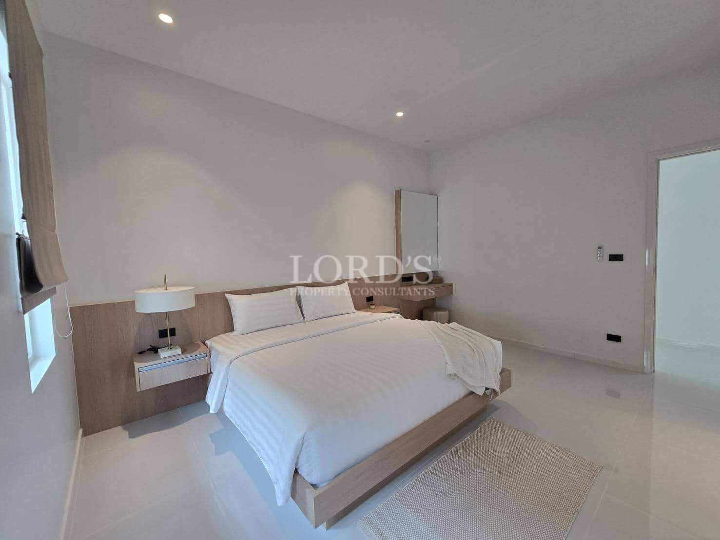 Modern, minimalist bedroom with natural light.