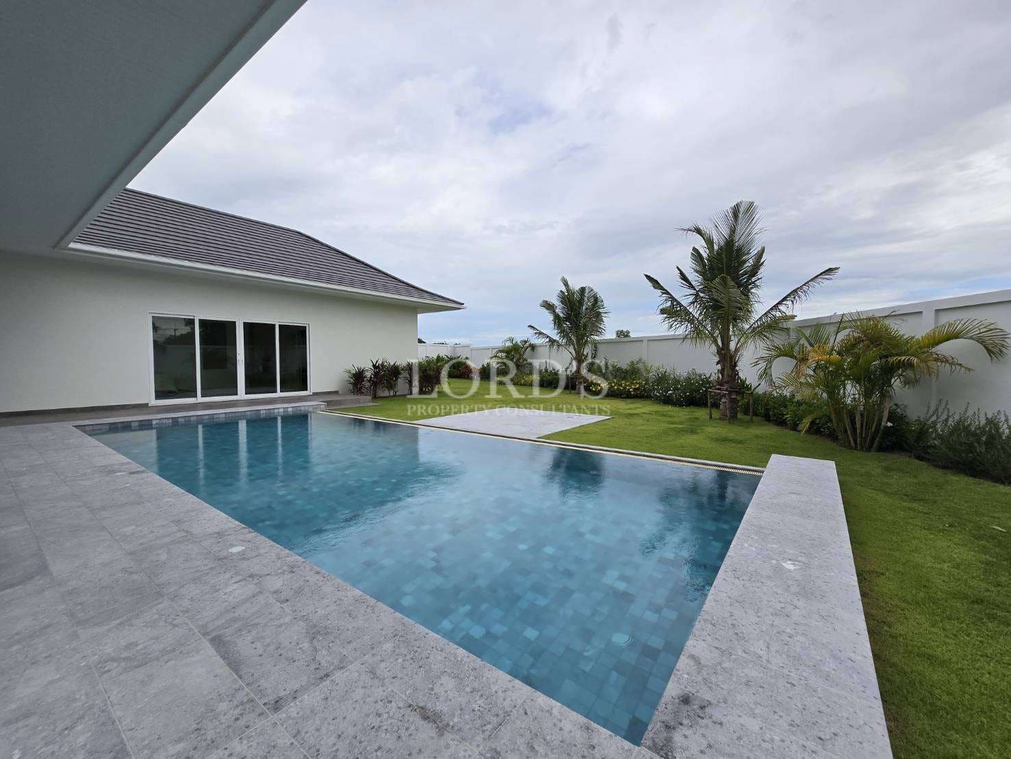 Modern house with pool and greenery