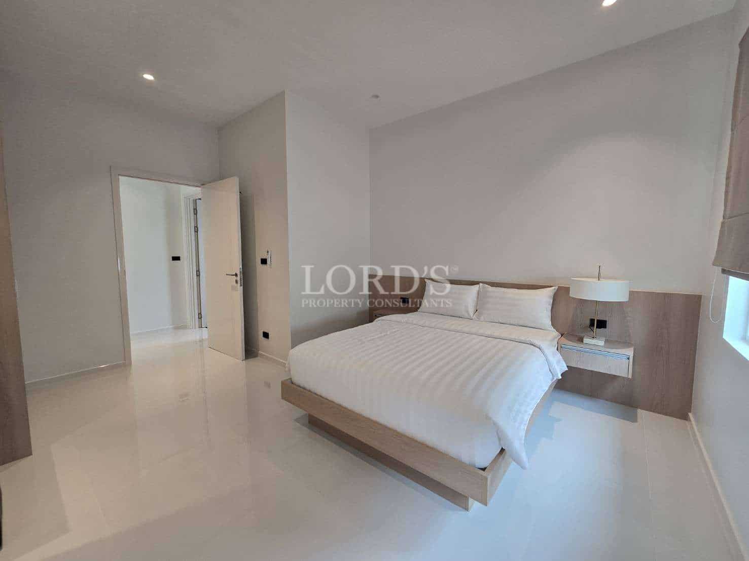 Modern, minimalist bedroom interior design.