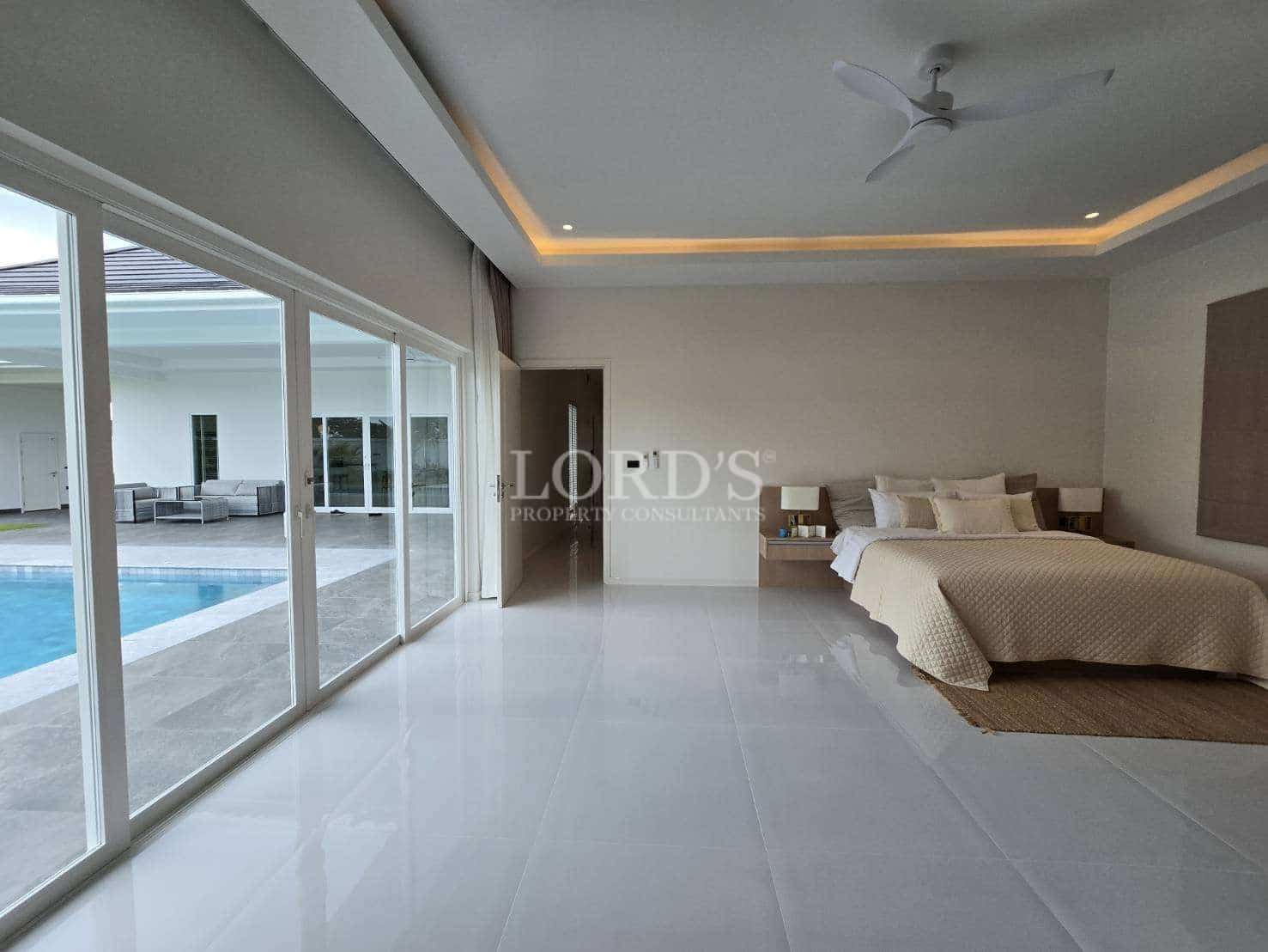 Modern bedroom with pool view