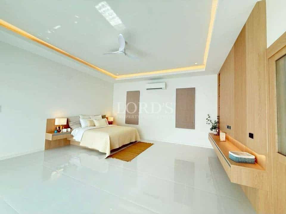 Modern, minimalist bedroom with natural light.