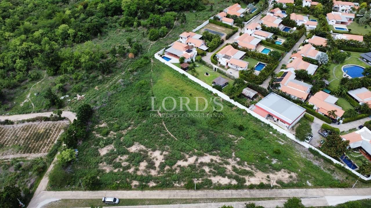 Aerial view of residential area and land.