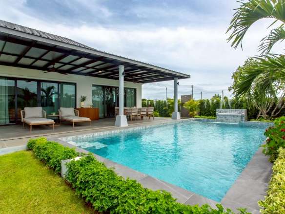 Modern villa with pool and greenery