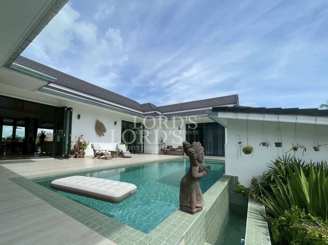 Modern villa with pool and sculpture