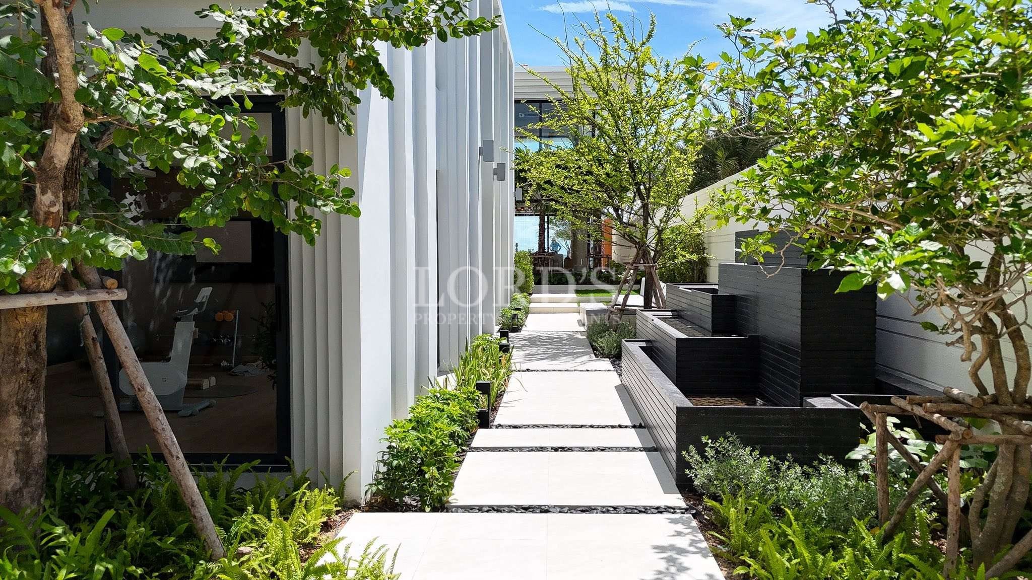 Modern pathway with greenery and water