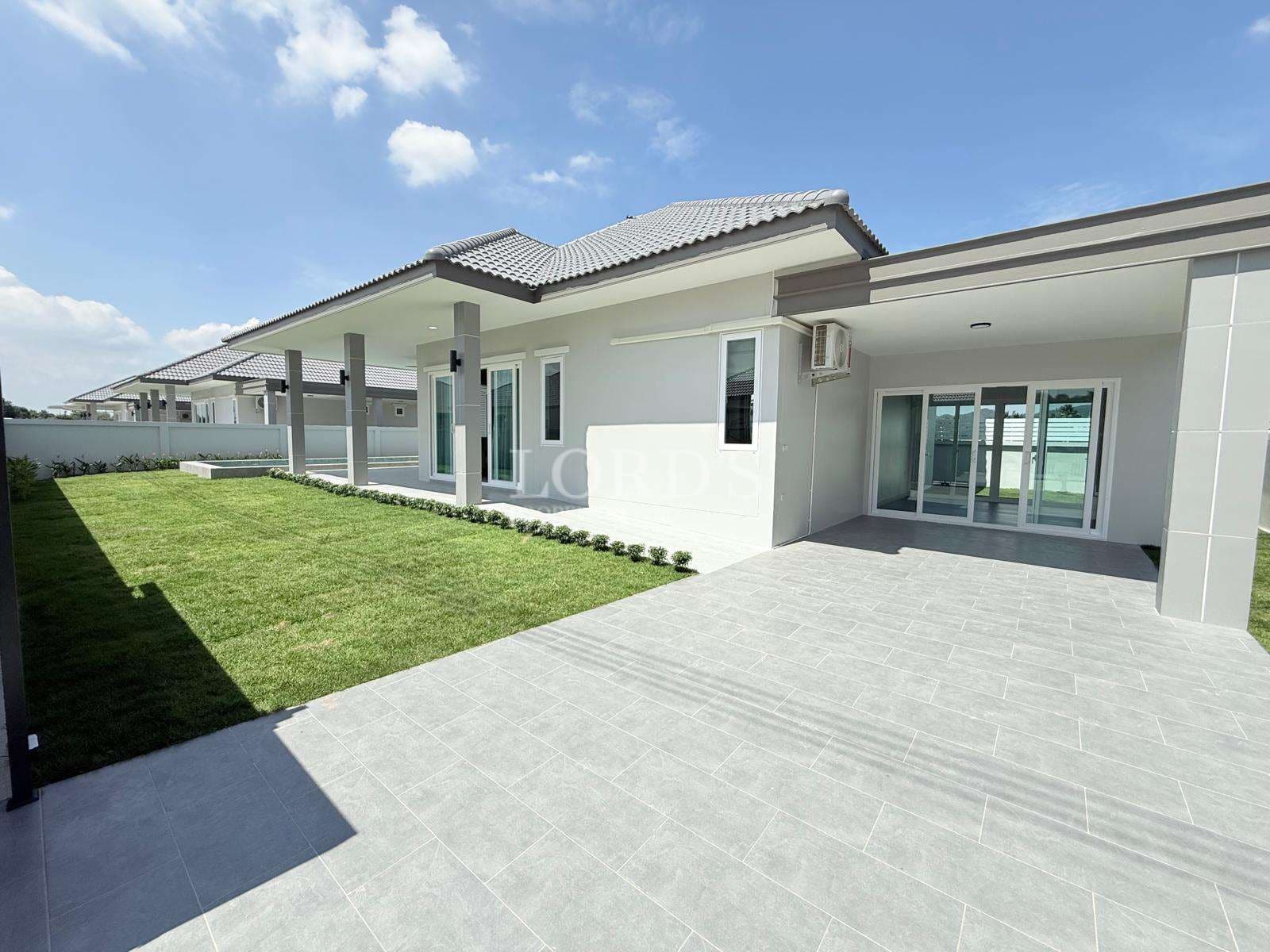 Modern house with green lawn
