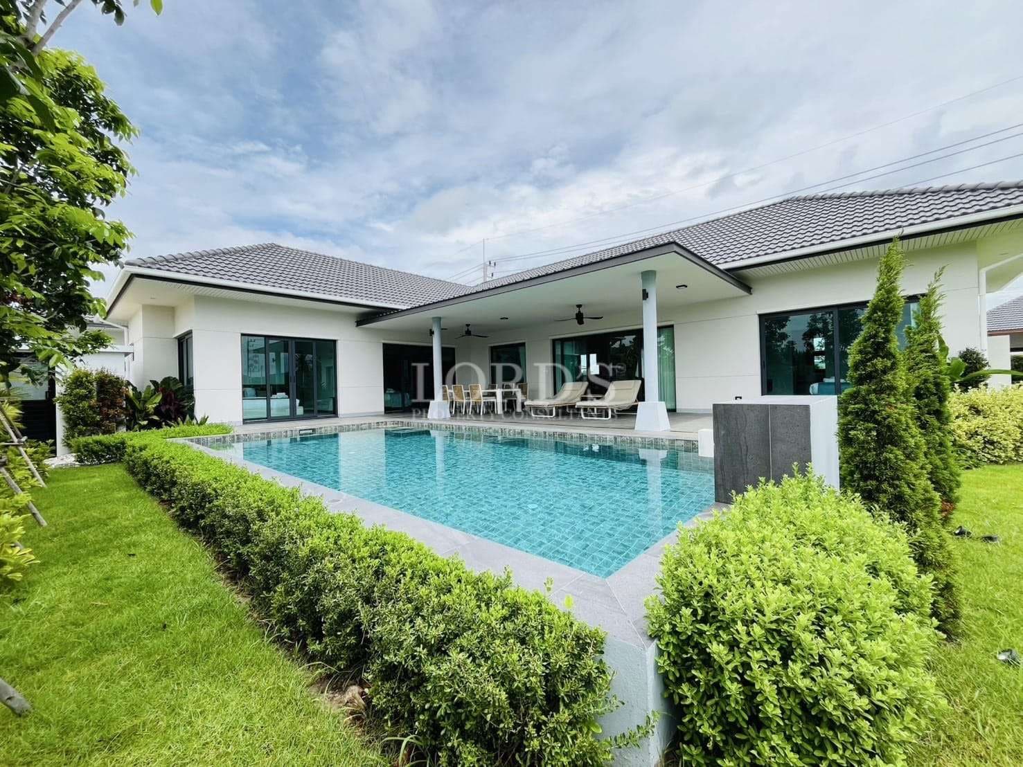 Modern single-story villa with private swimming pool and covered outdoor terrace.