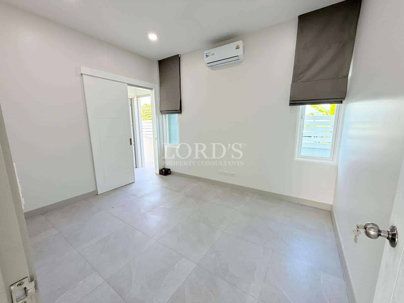 Empty room with light-colored walls