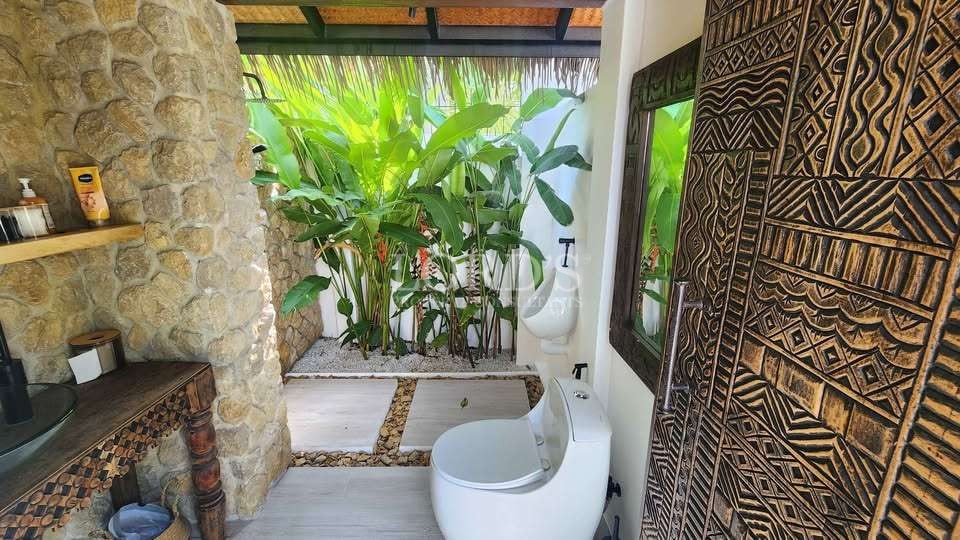Modern bathroom with tropical plants