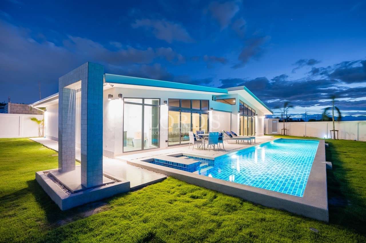 Modern house with pool at dusk