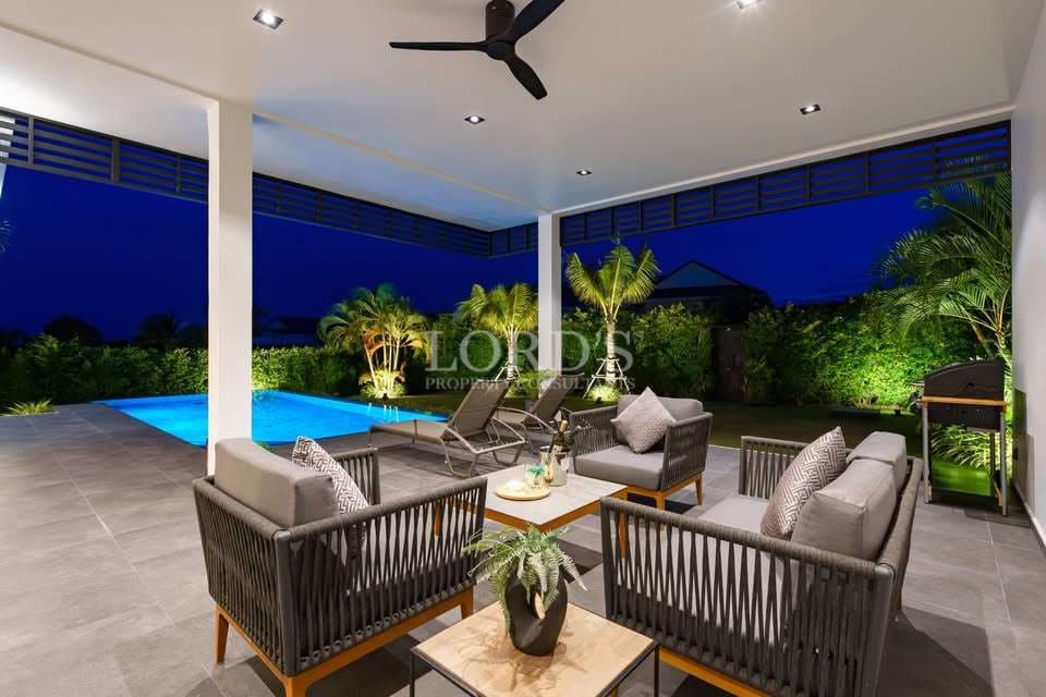 Modern patio with pool and seating