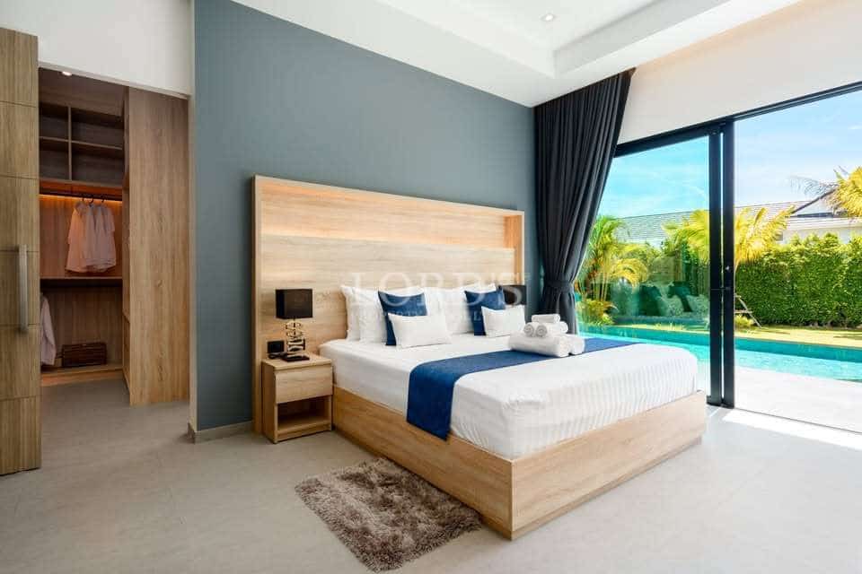 Modern bedroom with pool view