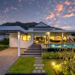 Modern villa with sunset backdrop