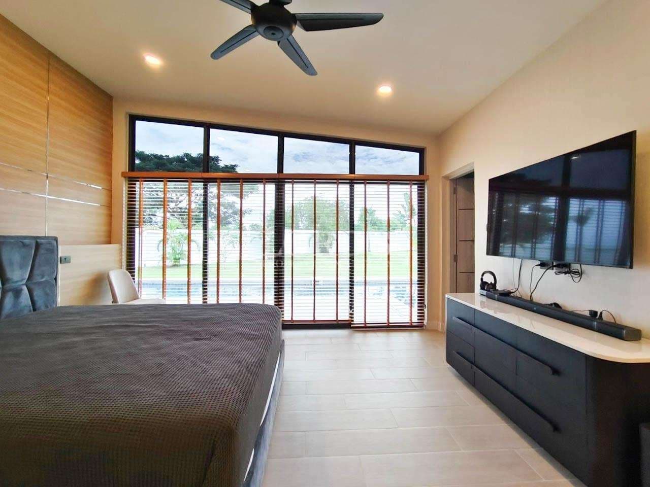 Modern bedroom with large windows