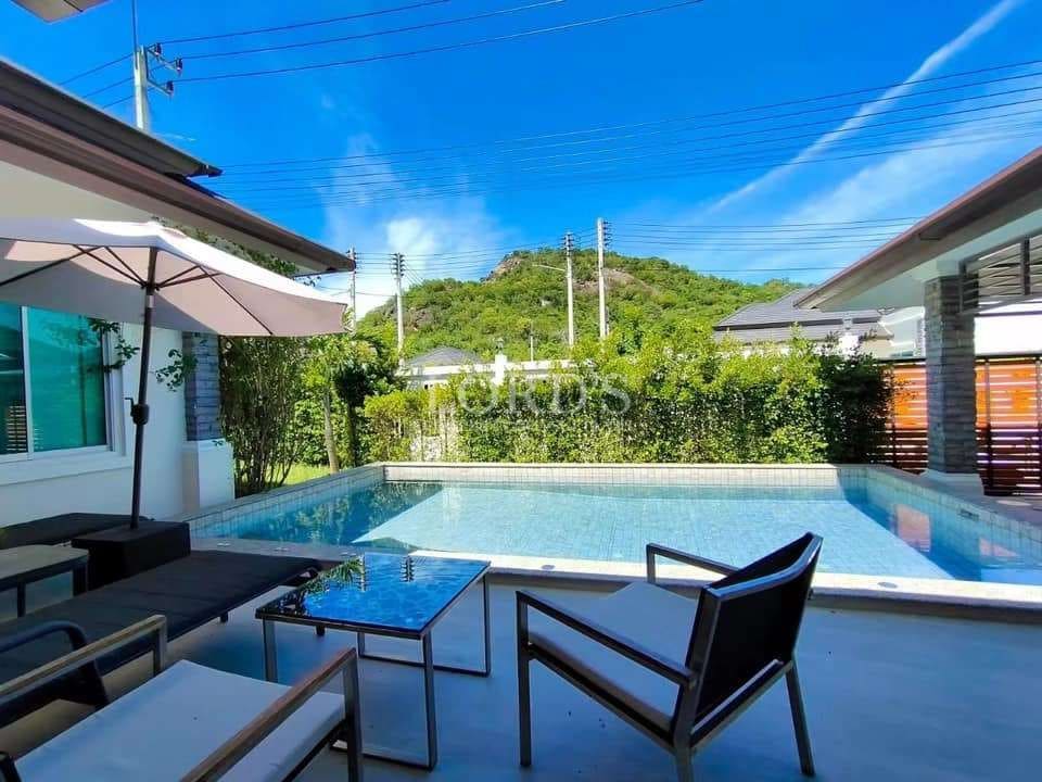 Modern poolside with mountain view