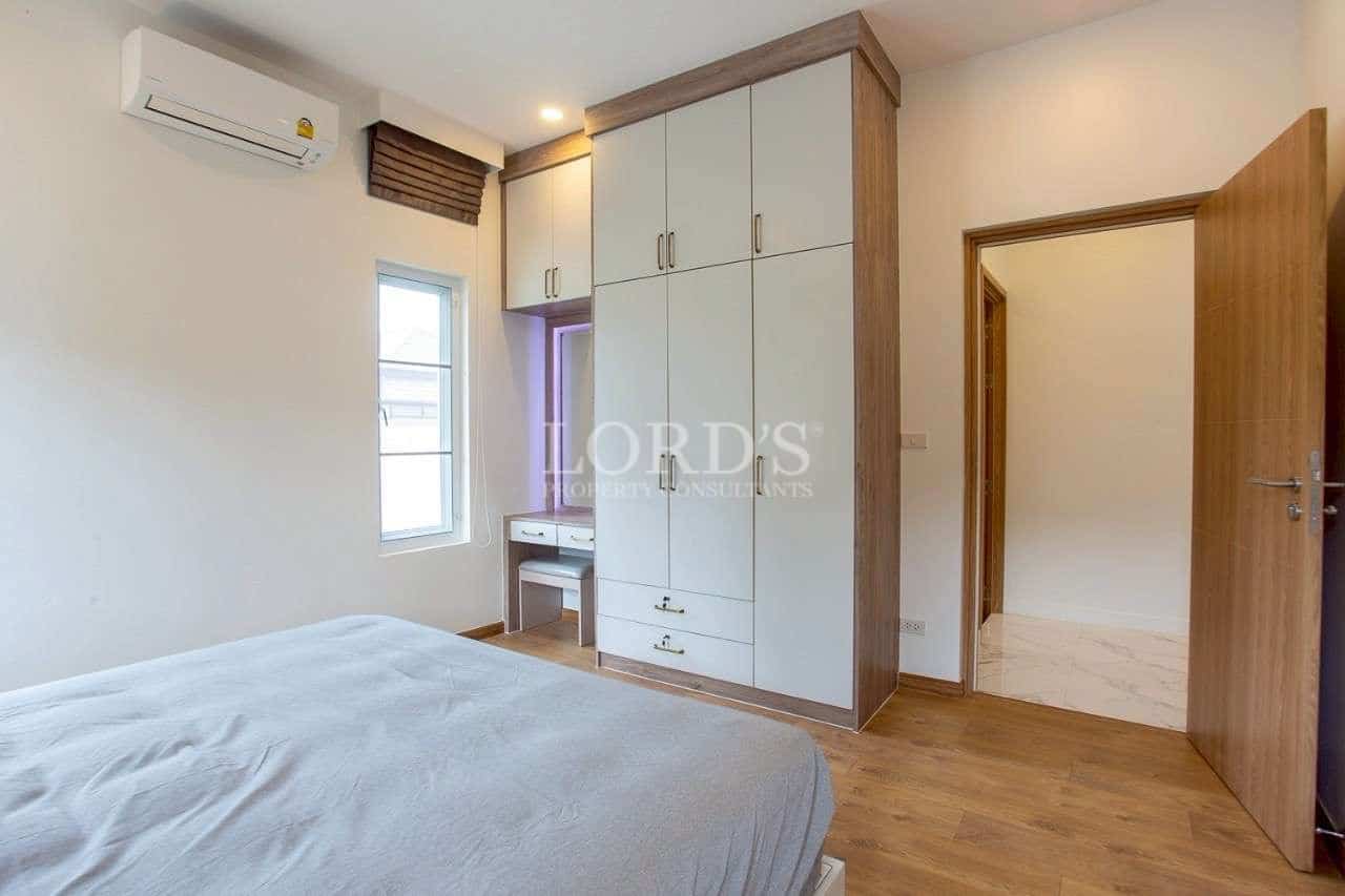 Modern bedroom with wooden furniture